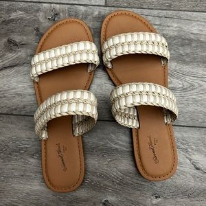 White and tan woven sandals